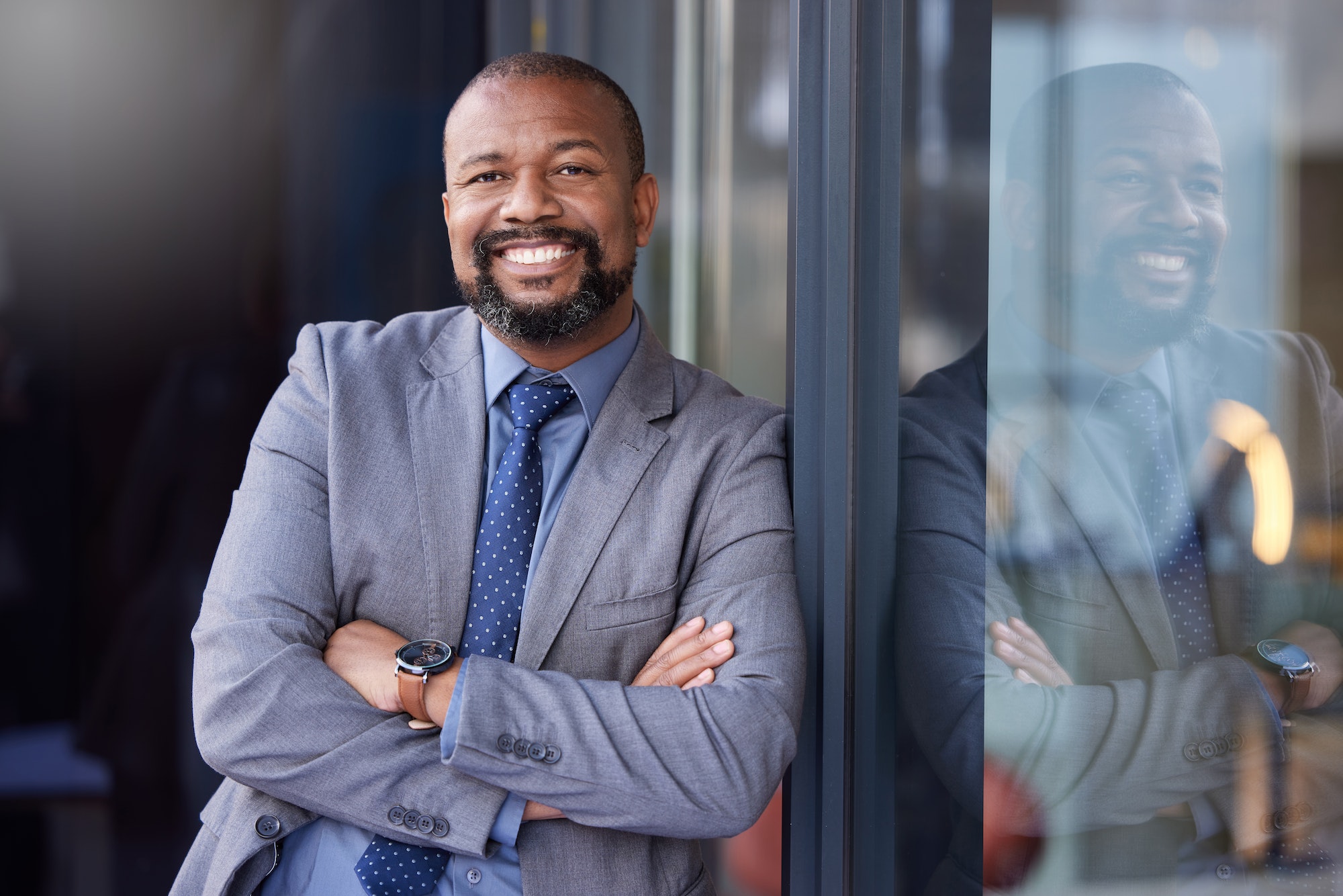 Shot of a businessman wearing a suit while standing outside